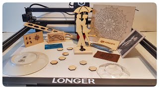 'LONGER RAY5' laser engraver with a touch screen  assembly and examples of engraving and cutting