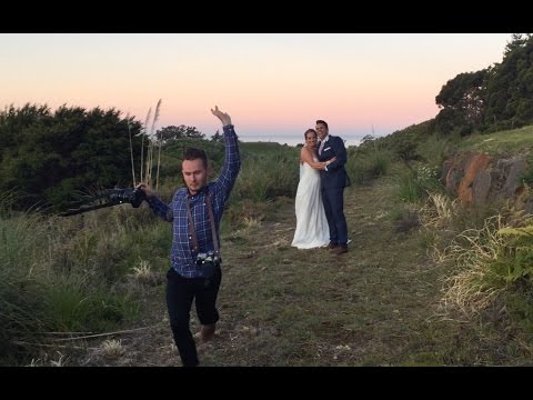 Hilarious wedding photographer making couple laugh