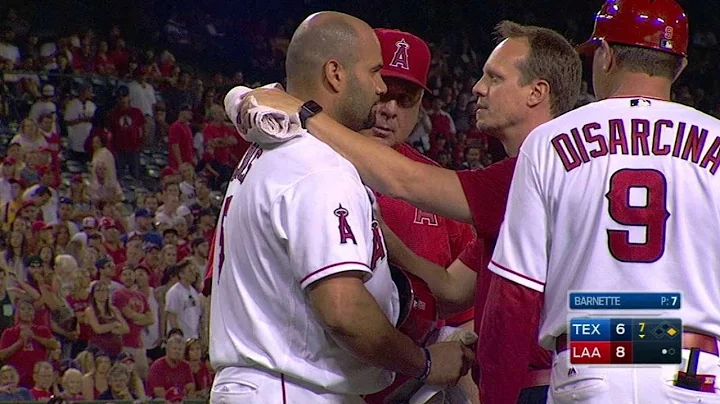 TEX@LAA: Pujols hit on the helmet, stays in game