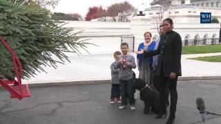 First Lady Michelle Obama Welcomes the Official White House Christmas Tree to the White House