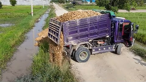 Amazing !! Start new project landfill by dump truck unloading soil and bulldozer working push fill