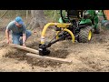 John Deere 1025R:  Post Hole Drilling Sucks You In