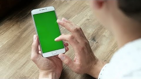 Young Man Using Phone with Mockup Green Screen | Stock Footage - Videohive