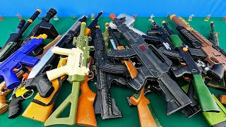 A Table of Legendary Toy Weapons  Realistic Shotgun, Assault and Sniper Rifles  Colorful SMGs