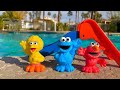 SESAME STREET Toys Slide In SWIMMING POOL Day!