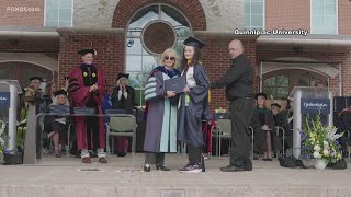 Nicole Cyr, of Quinnipiac, walks at graduation
