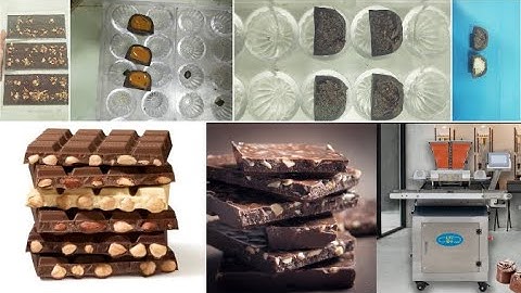 Chocolate Inclusions. Chocolate bar with nuts molding line.