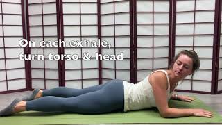 Sphinx pose with gentle trunk rotation
