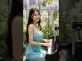 A beautiful girl playing the piano outdoors, with relaxing music and natural sounds.