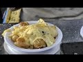 London Street Food. Preparing The Raclette of Melted Swiss Cheese.