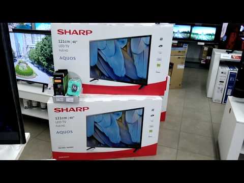 Телевизор Sharp LC-48CFE4042E. Стоит на коробках с другими телевизорами.