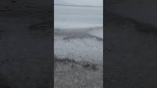 Rain falling on a frozen lake. #short #asmrrain