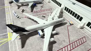 Gemini jets collection with ground vehicles at terminal   