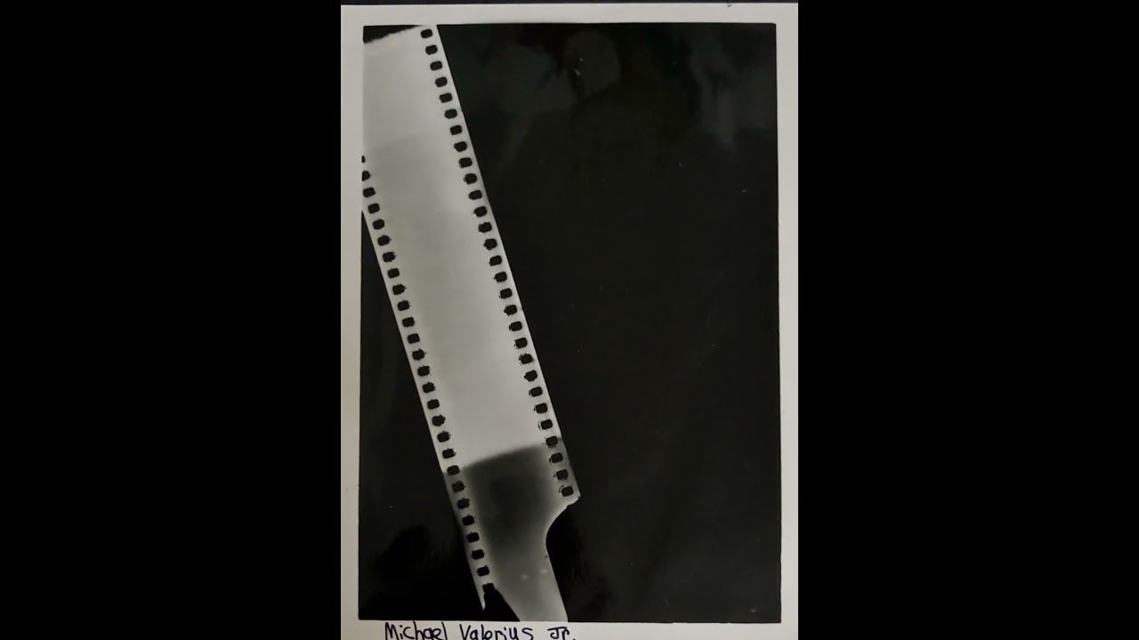 Black and white photograph of film strip negative.