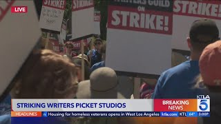 Writers picket Warner Brothers, Disney, CBS and more as strike begins