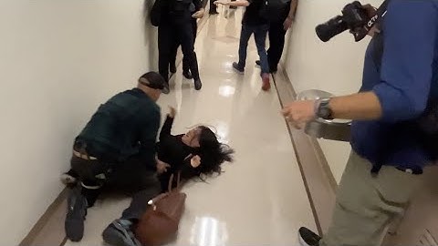 ICE agent pushes woman to the ground inside NYC immigration courthouse after husband detained