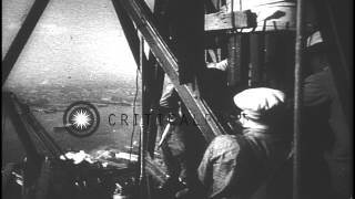 Workers build a light beacon tower 950 feet above the financial district and plac...HD Stock Footage