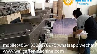 High speed corrugated paperboard partition assembler machine
