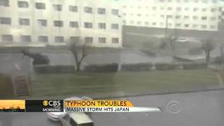 Japan typhoon sends car flying