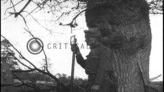 US 111th Infantry units rest and 119th Field Artillery troops fire French 75 mm f...HD Stock Footage