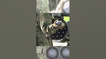 US Marines load weapons onto an Apache helicopter