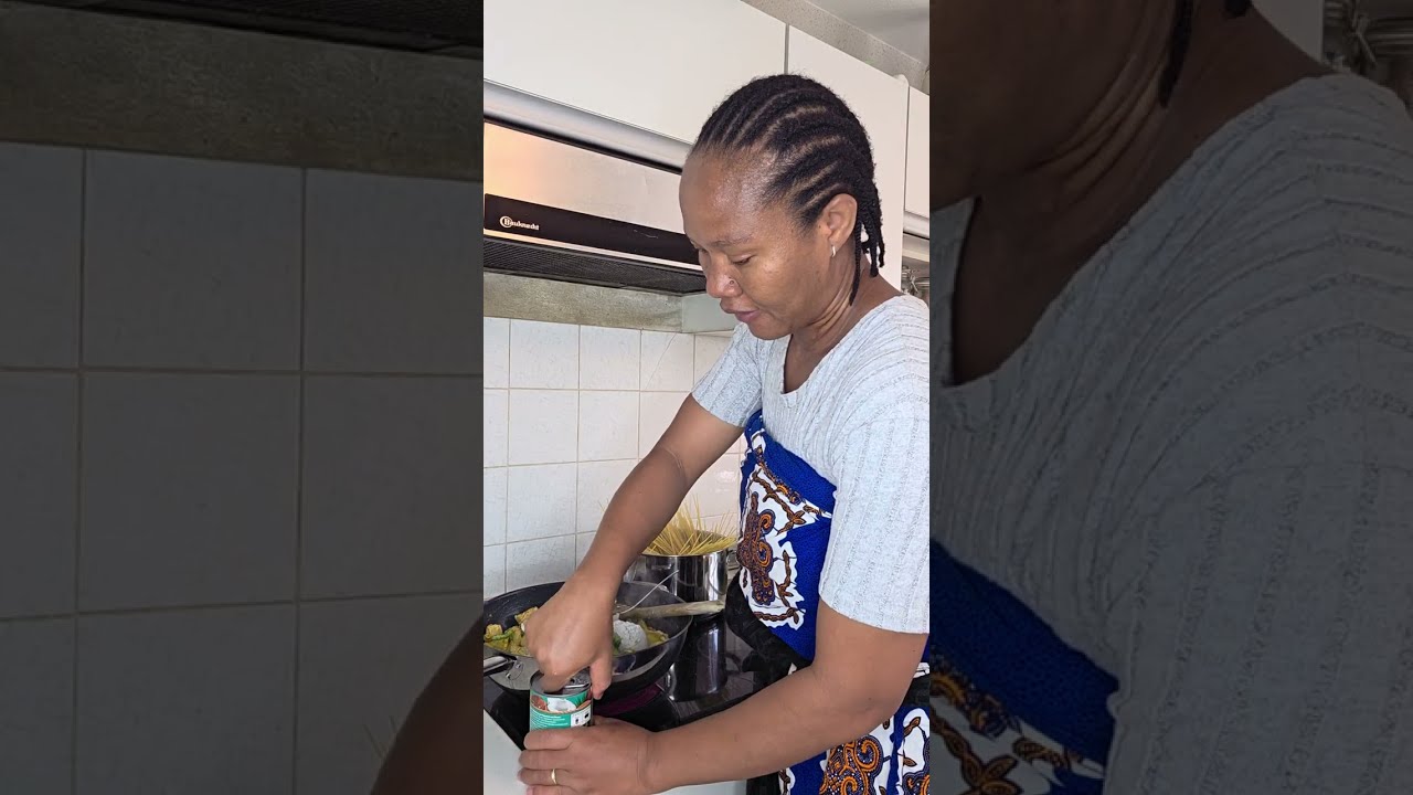 MOM COOKING CHICKEN CURRY SAUCE WITH COCONUT MILK ALONG WITH SPAGHETTI 