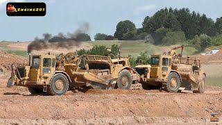 2 Caterpillar 627 Scrapers Working