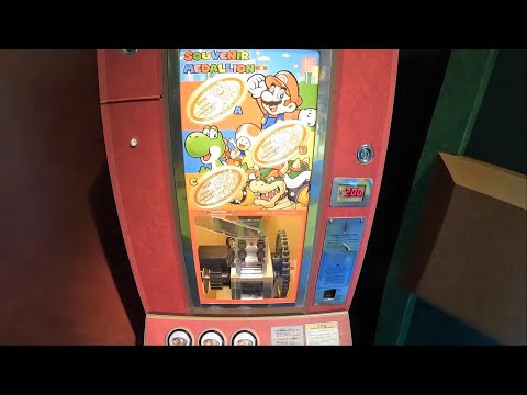 Super Nintendo World 1 UP Factory Mario Medallion Machine