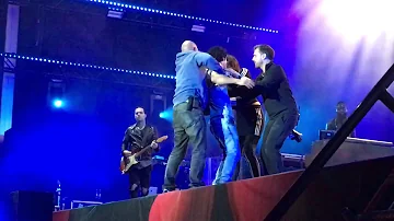 Fan sneaks on stage to hug Lana Del Rey during "ride" at flow festival in Helsinki, Finland