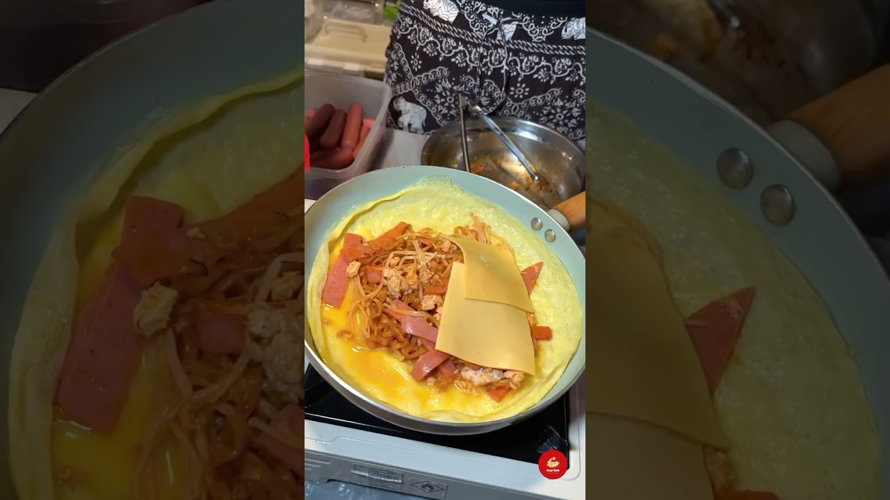 Spicy Buldak Ramyun wrapped in Egg, with Cheese—made by A Cute Punk Vendor!