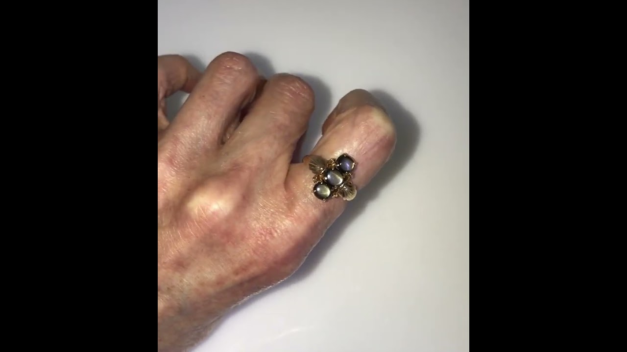 Signed Ty Lee triple Black Star Sapphire ring in 14k yellow gold. See that amazing play of light.