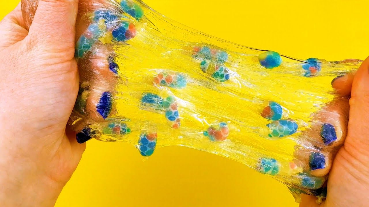 Mixing Mini Orbeez Stress Balls into Clear Slime - YouTube