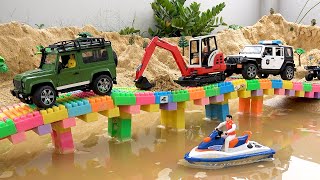 Mainkan mainan membangun jembatan mobil excavator