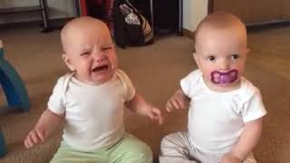 Twin baby girls FIGHT over pacifier (in REVERSE)