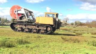 Slurry spreading with a track machine