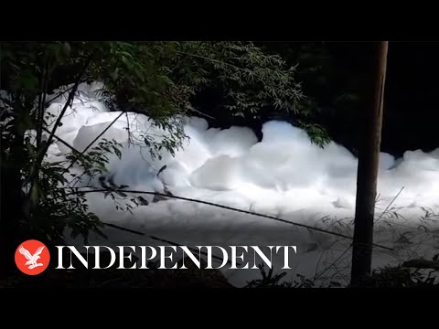 Acid spill covers Brazil river in thick white foam