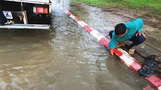 Go Out Working In The Rain Unclogged Flooded Street For Safety Driving