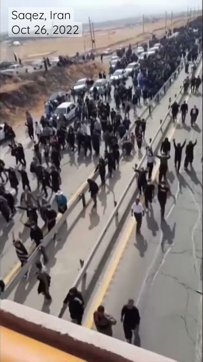 Thousands of Iranians march to burial site of Mahsa Amini, who died in custody at 22