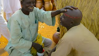 Traditional African barbers who you happily pay to drain your blood