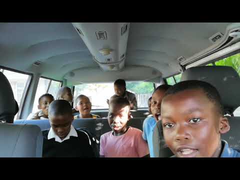 The t4c Futsal Academy boys see their new bus for the first time