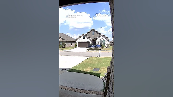 Caught on doorbell camera: wind gusts hurl trampoline onto roof of house