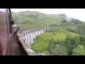 Harry Potter&#39;s Jacobite Steam Train Mallaig-Fort William crosses rainy Glenfinnan Viaduct, Aug. 2015