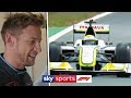 Jenson button drives 2009 brawn bgp001 car around silverstone