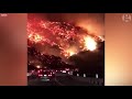 Commuter drives through raging wildfire in California – dashcam video