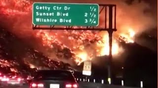 A motorist on the way to work 405 freeway in southern california films
raging wildfire. multiple blazes have erupted across region this week,
fo...
