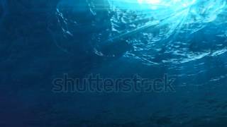 ocean waves from underwater slow motion light rays shining