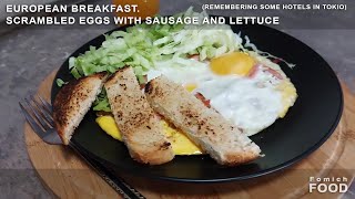 European breakfast. Scrambled eggs with sausage and lettuce.