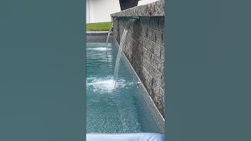 SWIMMING POOL BUILT WITH WATERFALL #pool #pooldesign #waterfall