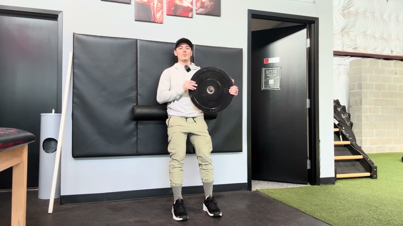 Foam Roller Wall Squat with Plate Reach