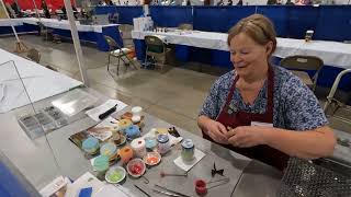 Jewellery making demonstration at Rock and Gem show Chilliwack, BC Canada. 2024